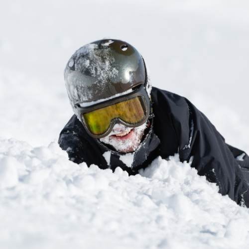 Skiier with a face full of snow - First Time Skiing In Morzine