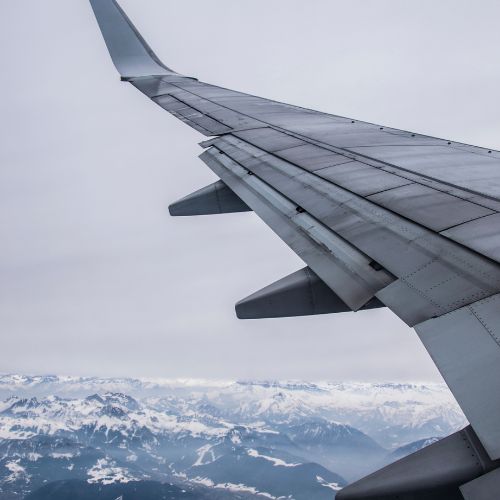 Geneva to Morzine Transfers in Winter - plane wing over GVA