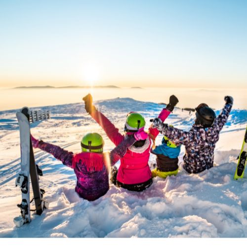 Is Morzine Family Friendly - Family sitting in snow